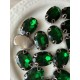 Стрази в цапах пришивні Овал 14*10 мм темно зелені  10 шт